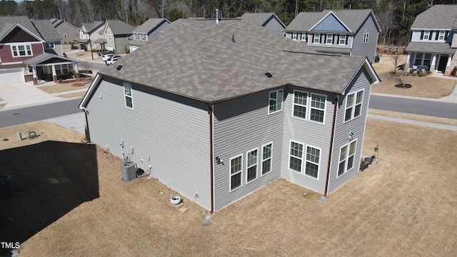 birds eye view of property with a residential view