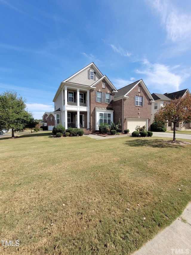 view of front of house with driveway, a porch, an attached garage, a front lawn, and brick siding