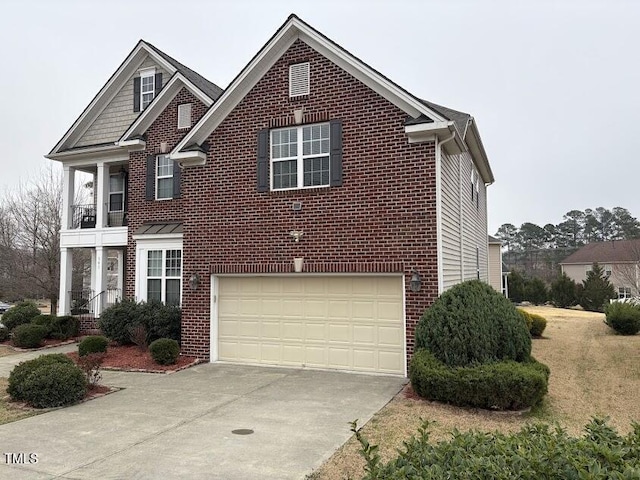 view of front of house with brick siding, driveway, and a garage