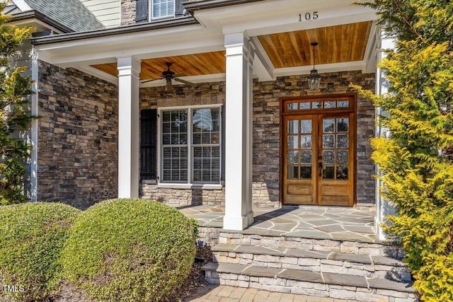 property entrance featuring stone siding and a porch