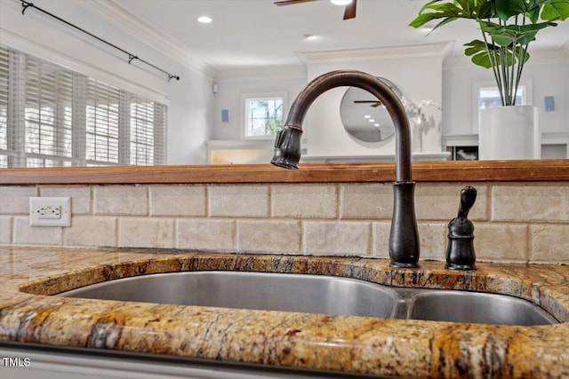 interior details with tile countertops, recessed lighting, a sink, a ceiling fan, and crown molding