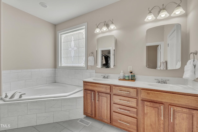 full bathroom with tile patterned flooring, a garden tub, a sink, and double vanity