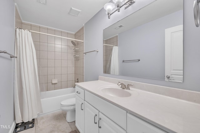 bathroom with toilet, shower / tub combo, visible vents, and vanity