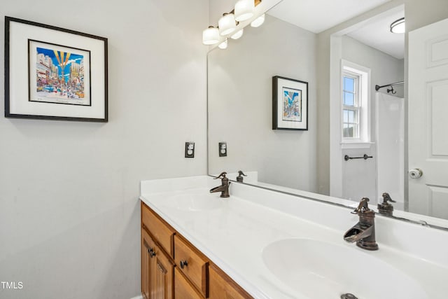 full bathroom with a sink and double vanity