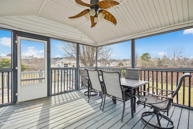 sunroom with lofted ceiling and ceiling fan