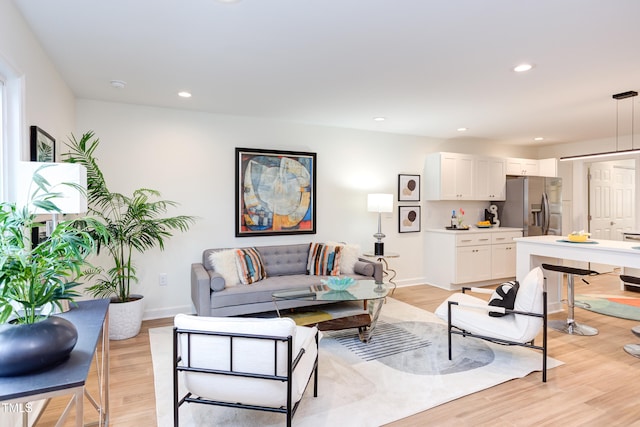 living room featuring light wood-style floors and recessed lighting