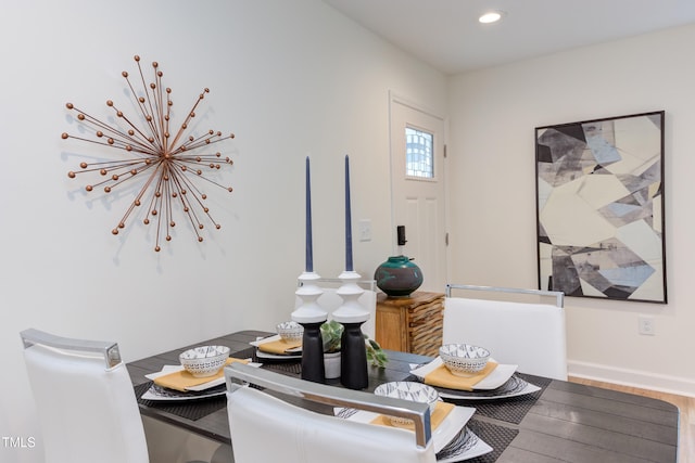 dining area featuring recessed lighting, baseboards, and wood finished floors