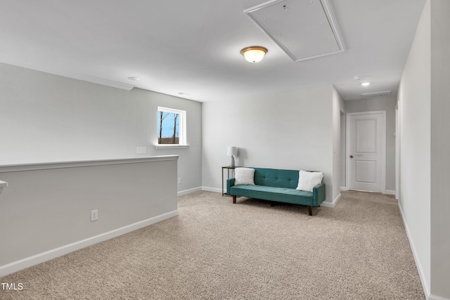 sitting room featuring visible vents, carpet floors, attic access, and baseboards