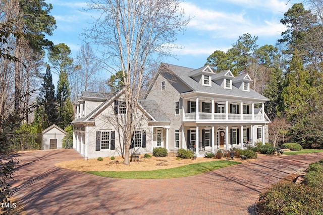 view of front of property with a balcony and a porch