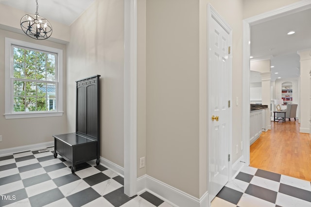 interior space featuring light floors, baseboards, a chandelier, and recessed lighting