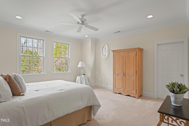 bedroom with baseboards, visible vents, crown molding, and light colored carpet