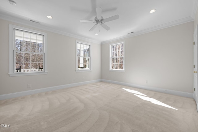 carpeted spare room with ornamental molding, recessed lighting, visible vents, and baseboards