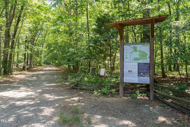 exterior space featuring a forest view