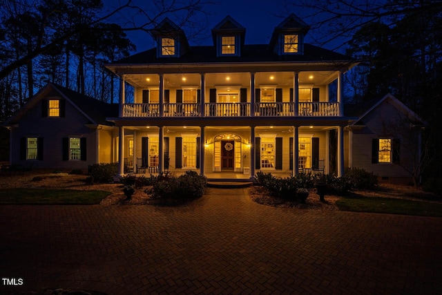 view of front of house with a balcony, crawl space, and a porch