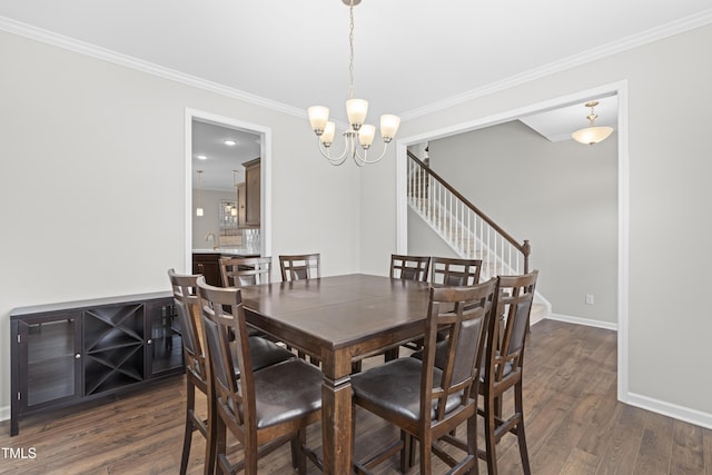 dining space with a notable chandelier, dark wood-type flooring, stairway, crown molding, and baseboards