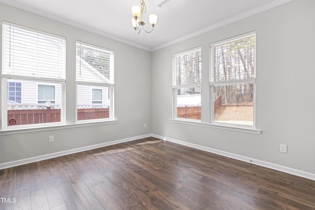 empty room featuring baseboards, an inviting chandelier, ornamental molding, and dark wood-style flooring