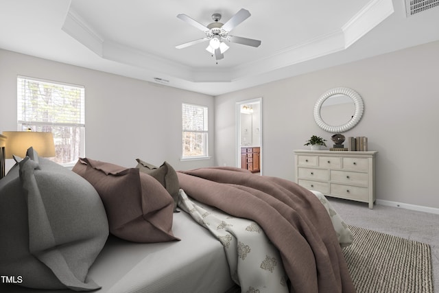 bedroom with visible vents, crown molding, baseboards, light carpet, and a raised ceiling