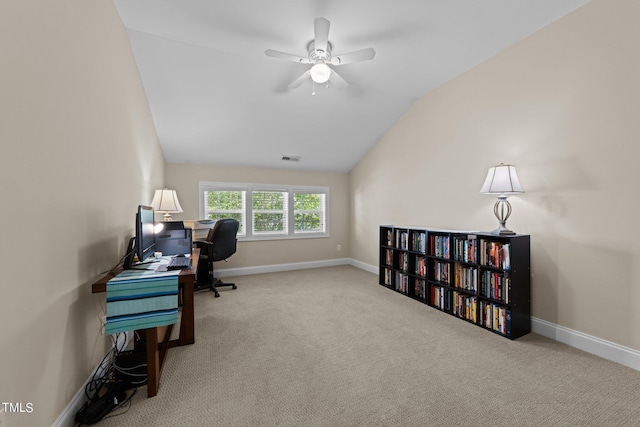 office featuring carpet floors, visible vents, vaulted ceiling, and baseboards