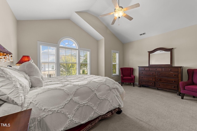 carpeted bedroom with visible vents, vaulted ceiling, and ceiling fan