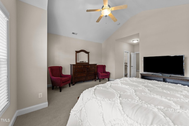 carpeted bedroom featuring lofted ceiling, visible vents, ceiling fan, and baseboards