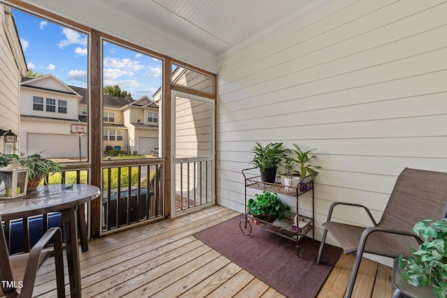 sunroom / solarium with a residential view