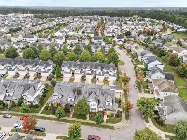 birds eye view of property with a residential view