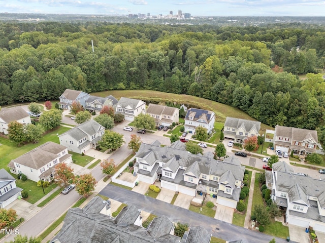 aerial view featuring a residential view and a view of trees