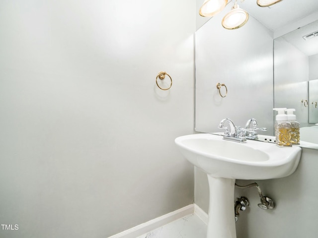 bathroom featuring marble finish floor, visible vents, and baseboards