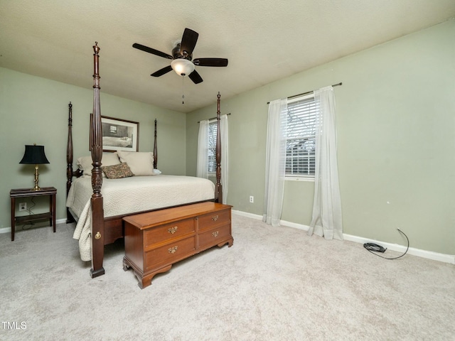 bedroom with carpet, baseboards, and ceiling fan