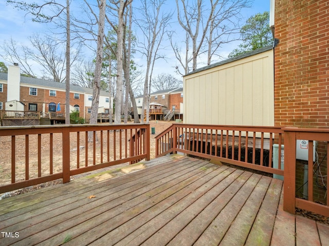 wooden deck with a residential view