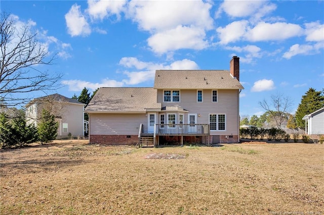 back of house with a deck, a yard, crawl space, and a chimney