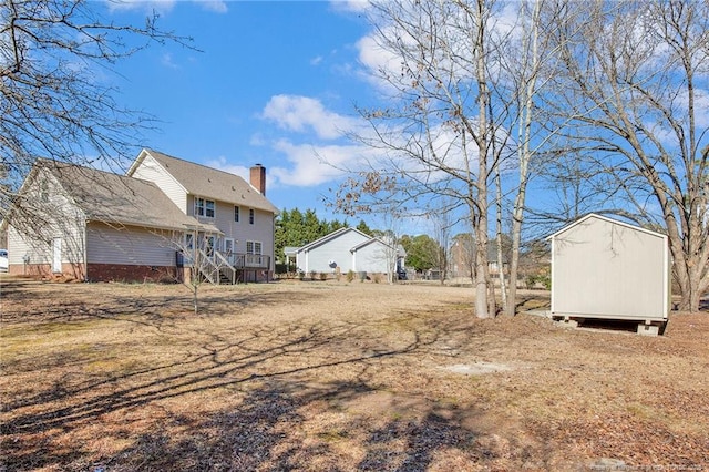 view of yard with a shed and an outdoor structure