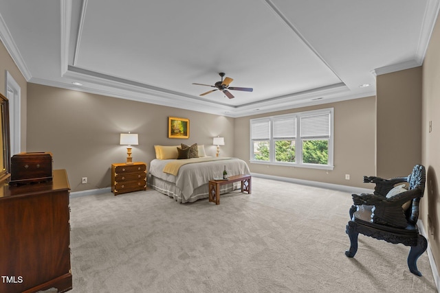 bedroom featuring ceiling fan, baseboards, ornamental molding, carpet flooring, and a raised ceiling