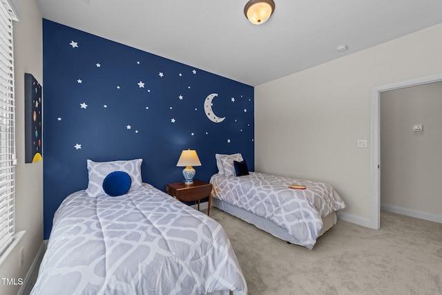 bedroom featuring baseboards and carpet floors