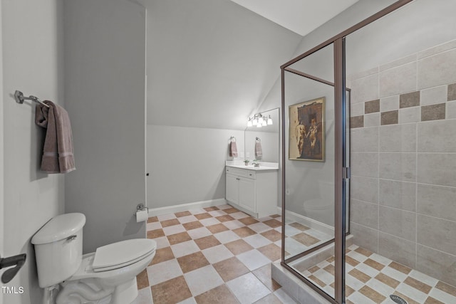 bathroom with vanity, a shower stall, toilet, and lofted ceiling