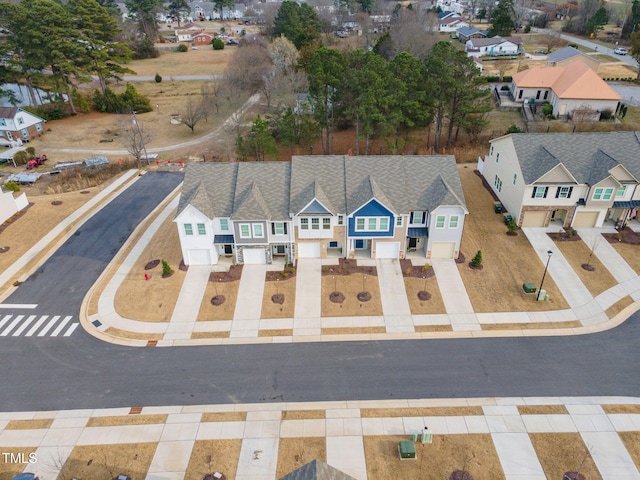 birds eye view of property with a residential view