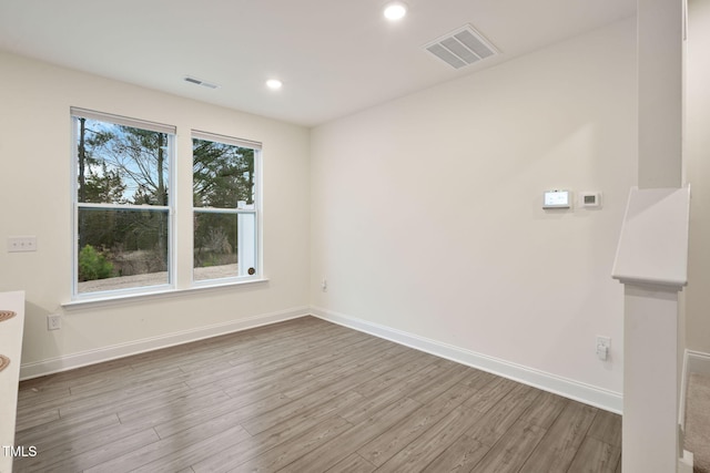 131 Wildflower Cir, Clayton, NC 27520 - empty room with wood finished floors, baseboards, and recessed lighting