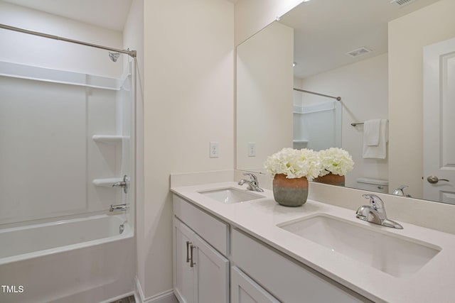 131 Wildflower Cir, Clayton, NC 27520 - bathroom with shower / bath combination, toilet, and double vanity