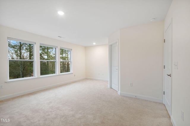 131 Wildflower Cir, Clayton, NC 27520 - unfurnished room with light carpet, recessed lighting, and baseboards