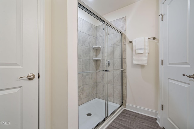 131 Wildflower Cir, Clayton, NC 27520 - full bathroom with a shower stall, baseboards, and wood finished floors