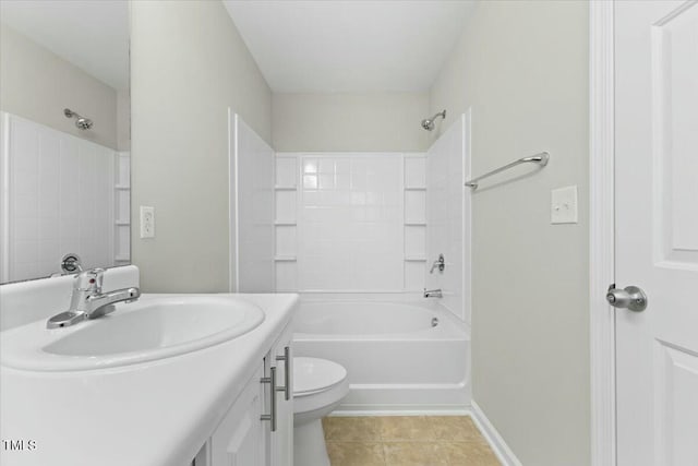 full bath with tile patterned flooring, toilet, vanity, baseboards, and washtub / shower combination