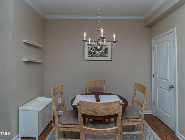 dining area featuring radiator, dark wood-style floors, baseboards, ornamental molding, and a chandelier