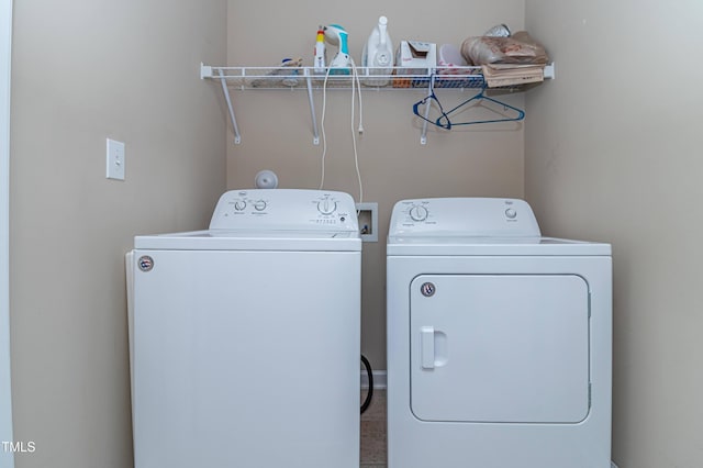 laundry room featuring washer and clothes dryer and laundry area