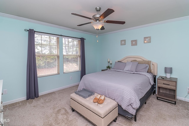 bedroom featuring a ceiling fan, carpet, baseboards, and ornamental molding