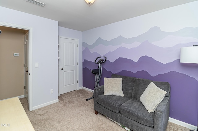 sitting room featuring visible vents, carpet floors, and baseboards