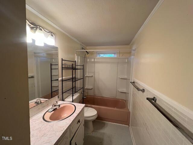 167 Chic Ennis Rd, Coats, NC 27521 - bathroom with toilet, shower / bath combination, crown molding, wainscoting, and vanity