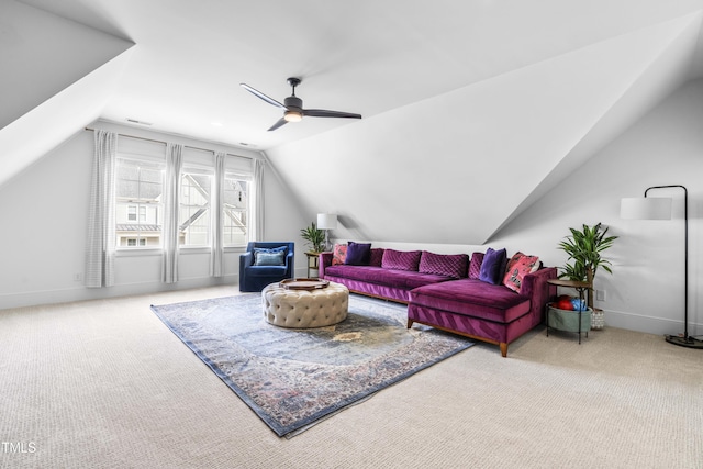 carpeted living area featuring visible vents, baseboards, ceiling fan, and vaulted ceiling