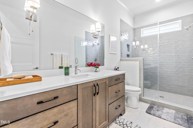 bathroom with vanity, ornamental molding, a shower stall, tile patterned floors, and toilet