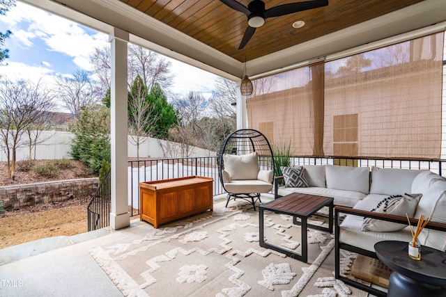 view of patio / terrace with outdoor lounge area, fence, and ceiling fan