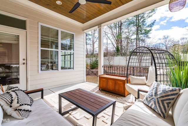 view of patio / terrace with an outdoor hangout area, ceiling fan, and fence